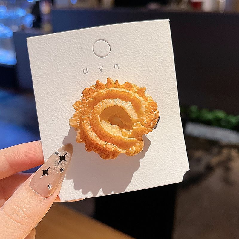 Ring cookie hair clip on its backing card