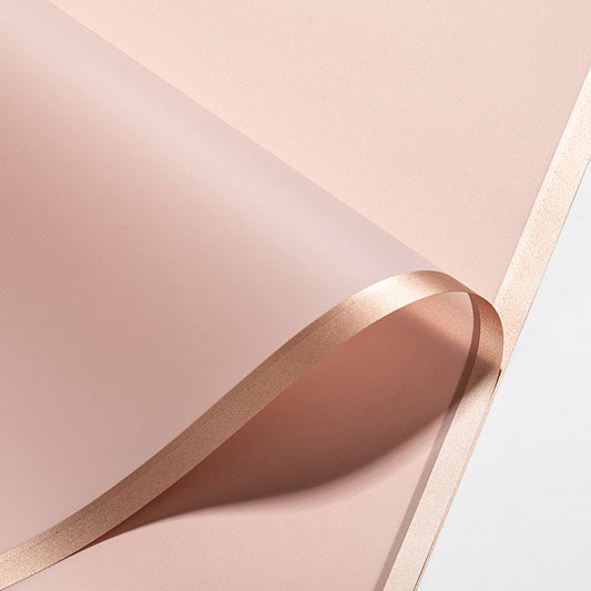Pink frosted florist wrap with a gold edge, 20 sheets 58 x 58 cm, included with the With florist wrap option only