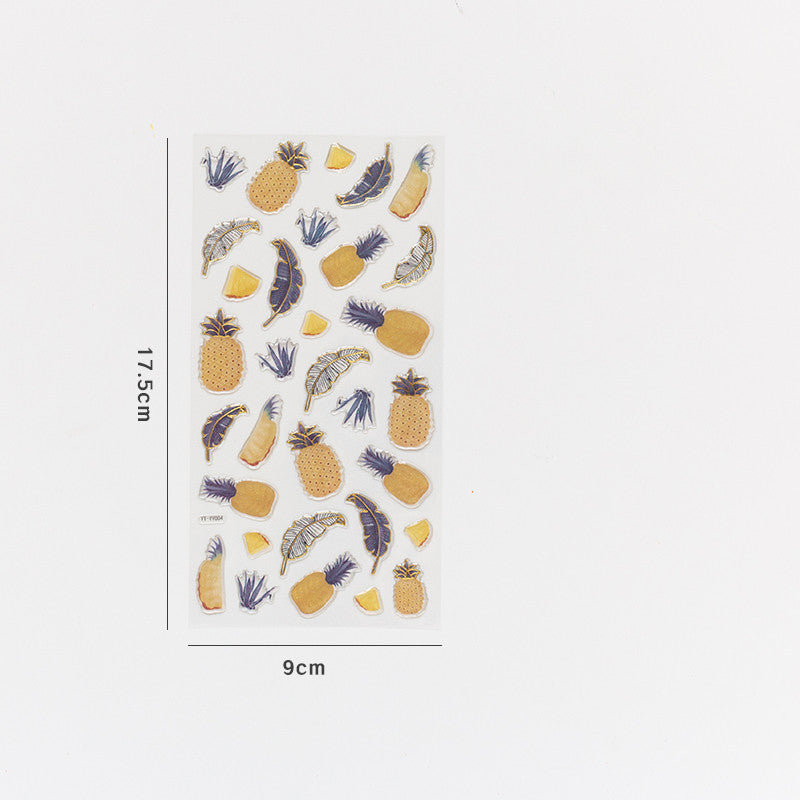 One 17.5×9cm sticker sheet showing metallic gold pineapple shapes and blue leaves on white background.
