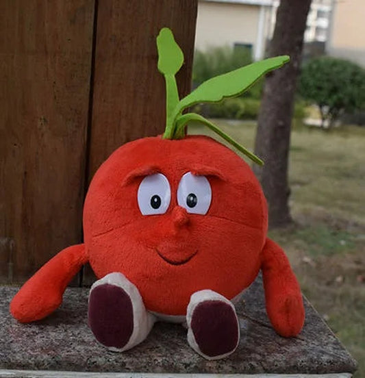 One round red plush fruit with smiling face, white eyes, green felt leaves, arms and maroon-and-white feet.