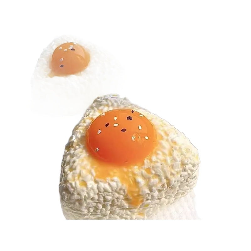 Egg yolk rice ball squishy on a white background