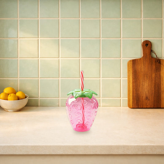 Pink strawberry water bottle on a kitchen worktop