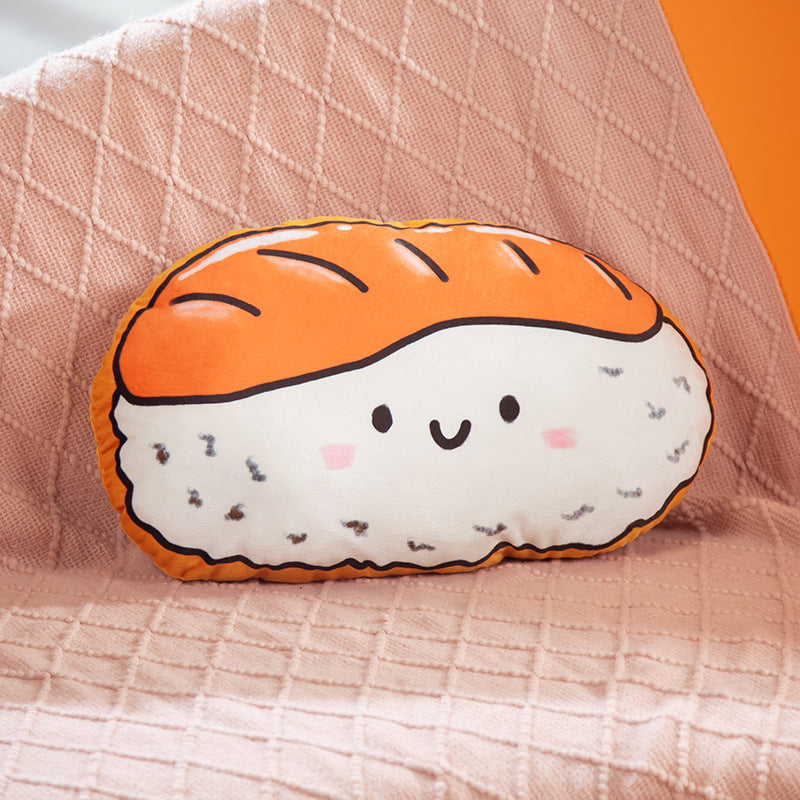 One oval sushi-shaped plush cushion with orange topping, white rice base, black specks and a smiling face.