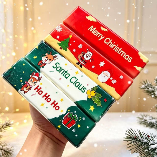 Hand holding a stack of Christmas butter stick squishies