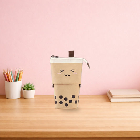 Brown boba milk tea pen pouch standing on a light oak desk