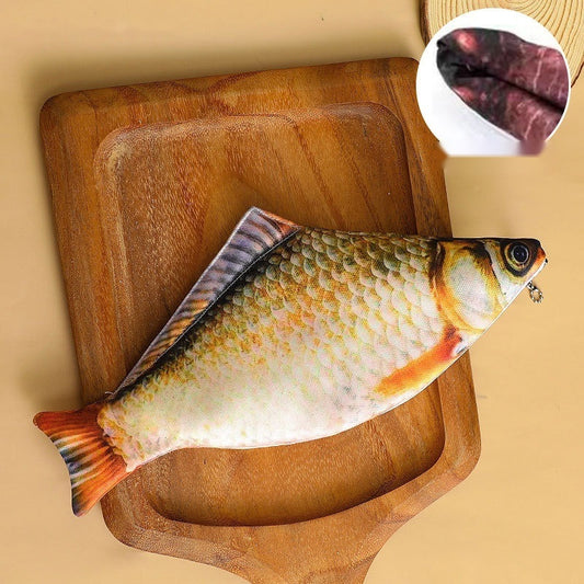 Crucian carp fish pencil case on a wooden board, with its dark red lining