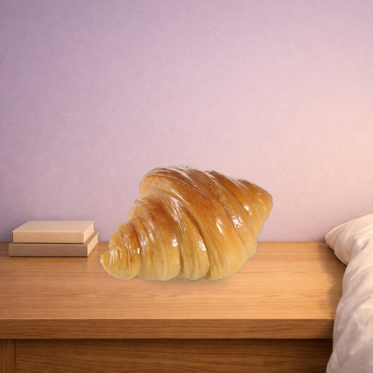 Croissant night light on an oak bedside table