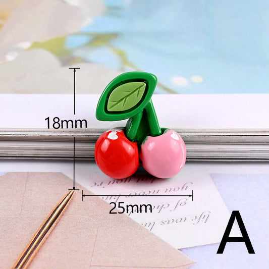 Single resin cherry cabochon: one red and one pink cherry with green stems and leaf, labeled 18mm x 25mm.