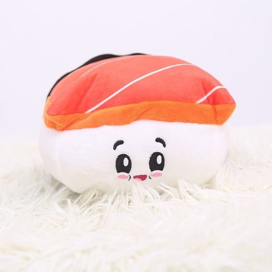 One plush sushi nigiri with orange-red fish top, white rice and embroidered black eyes, pink cheeks.