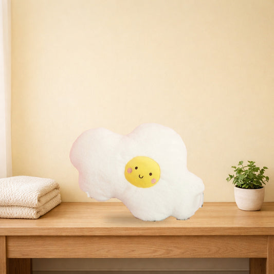 Fried egg plush cushion standing on a light oak console table