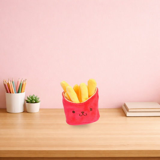 Red plush french fries keychain on a wooden desk