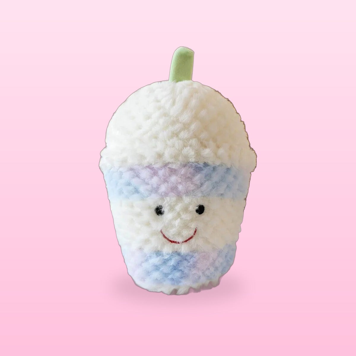 Fluffy bubble tea plush in white and pastel blue with a green straw, on a bubblegum pink background