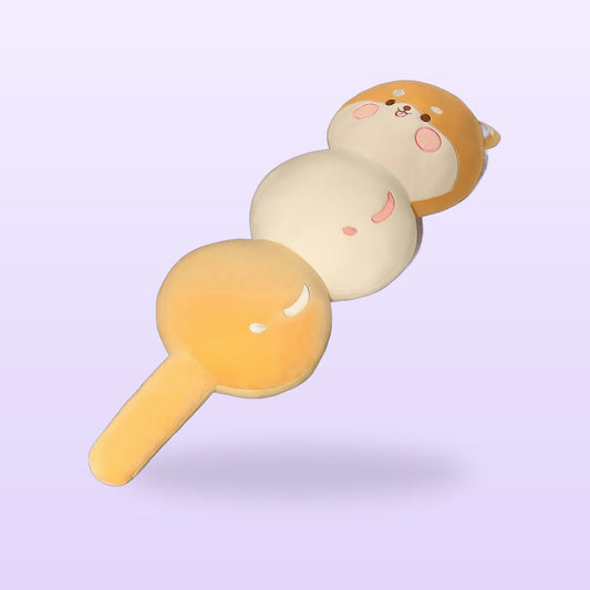 Shiba candied fruit skewer plush pillow in orange and cream, on a lilac background