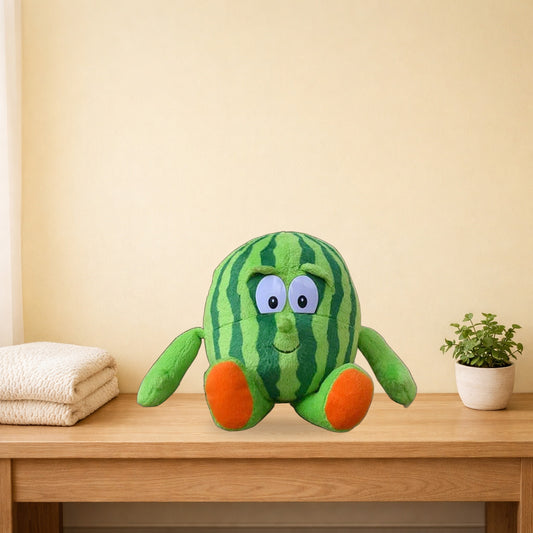 Watermelon fruit and veg buddies plush sitting on a light oak bench