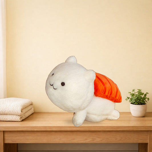Sushi cat plush pillow with a salmon topping lying on a light oak console table