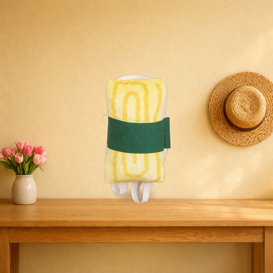 Omelette sushi plush backpack standing on a light oak console table