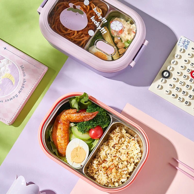 Fruit print bento boxes filled with noodles, rice and salad