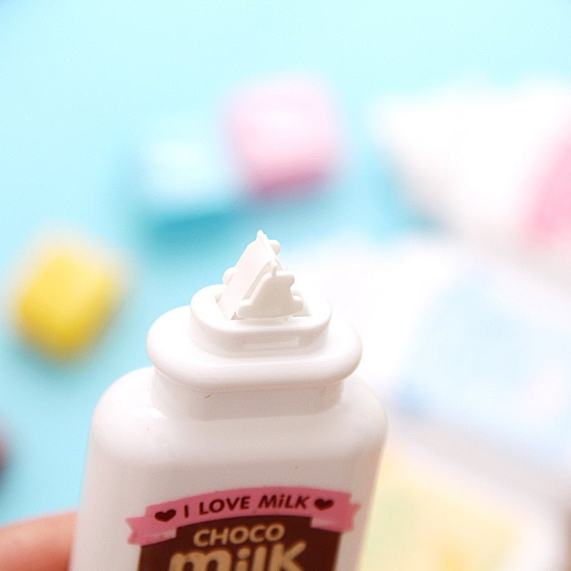 Close up of the correction tape tip on a choco milk bottle