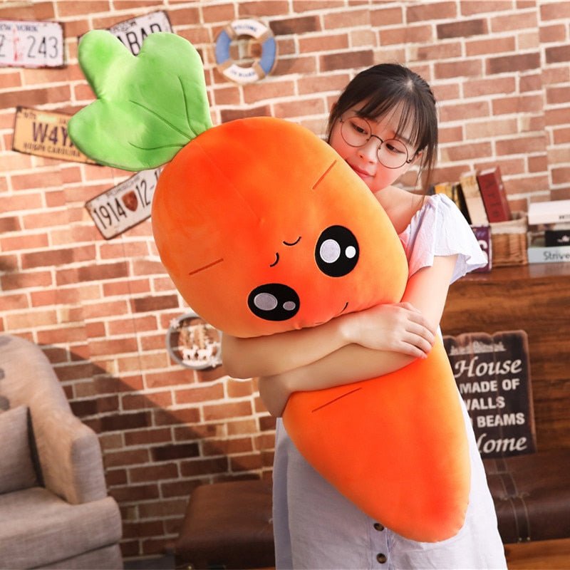 Person hugging a large smiling carrot plush pillow