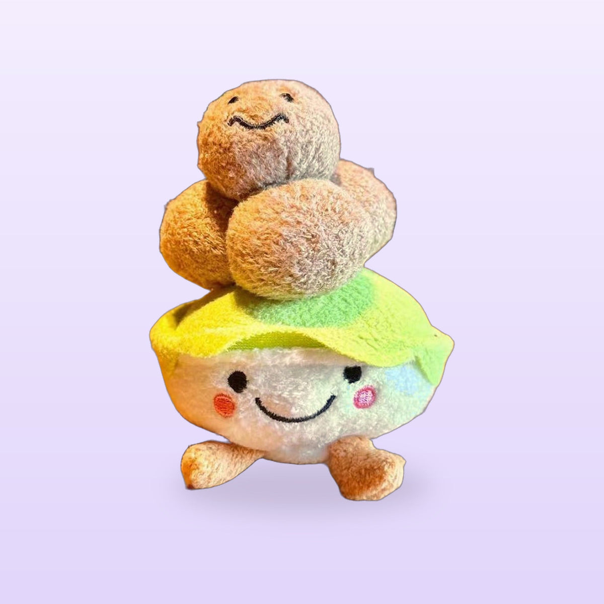 Beef ball bowl plush keychain with a little face, on a soft lilac background
