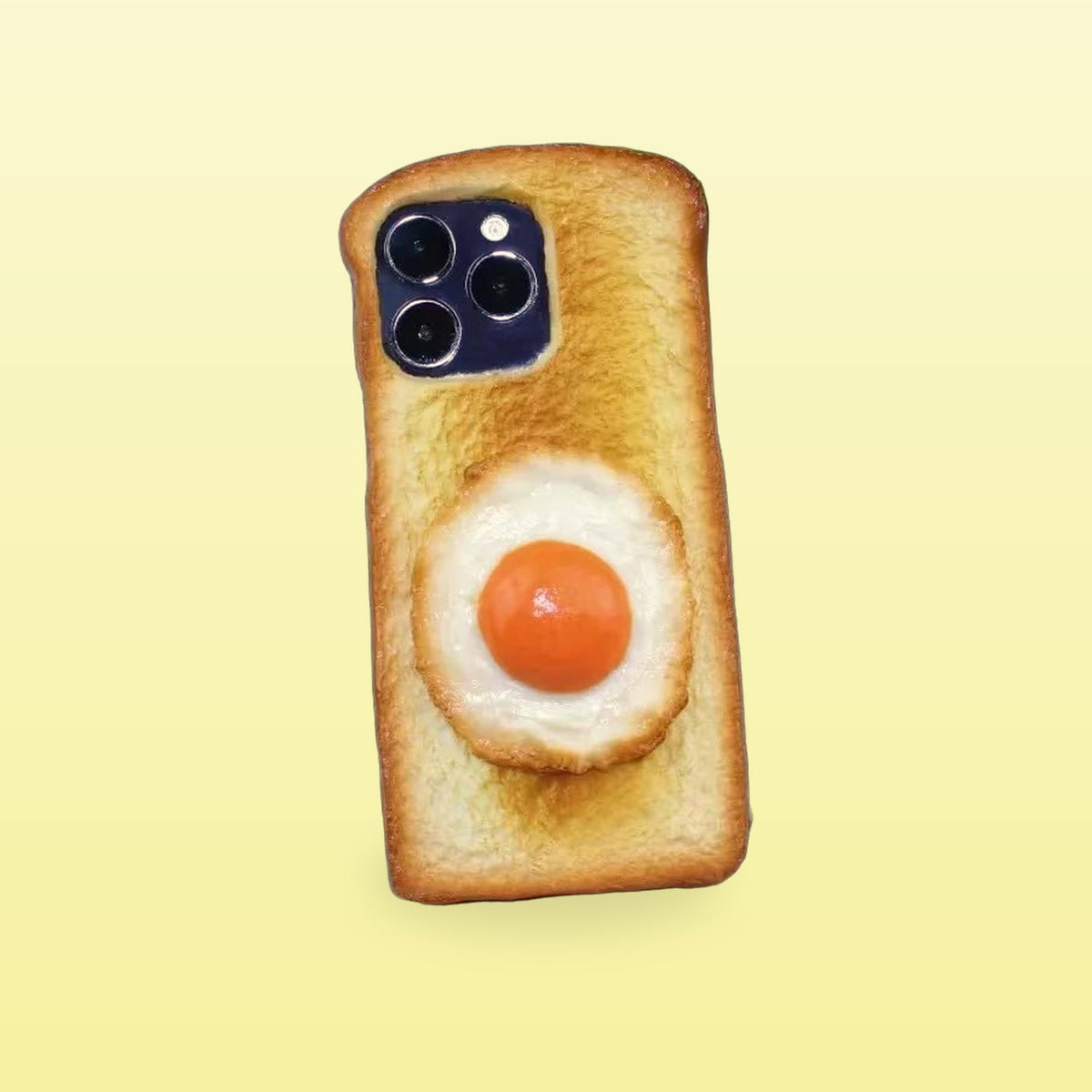 Fried egg toast iPhone case, back view, on a butter yellow background