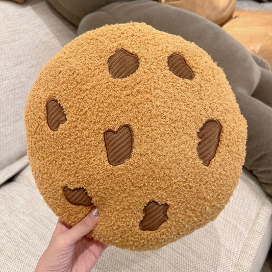 Holding the fluffy chocolate chip cookie cushion
