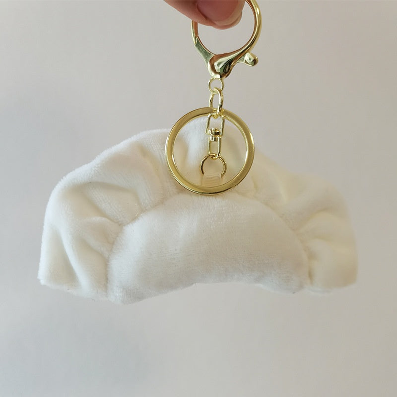 Dumpling plush keychain with a gold clasp