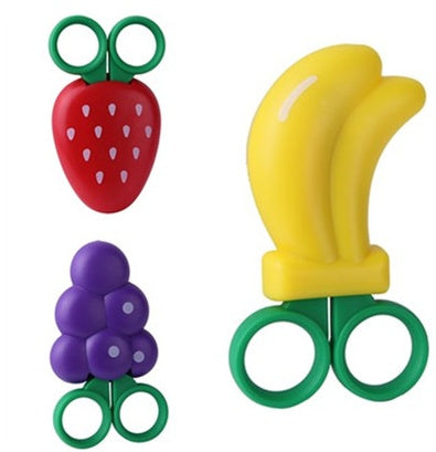 Three food-shaped bag clips: red strawberry, purple grapes, and yellow banana, each with green loop handles.