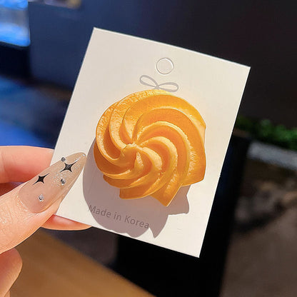Swirl cookie hair clip on its backing card