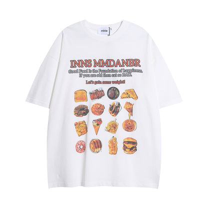 White oversized T-shirt featuring a vibrant BBQ food print, including burgers, ice cream, and snacks with playful text.