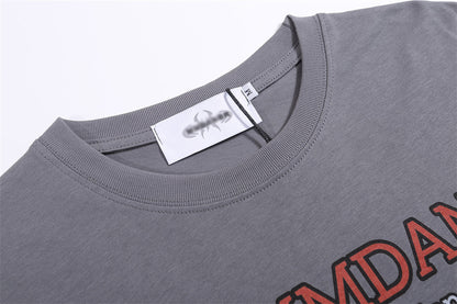 Grey T-shirt featuring a BBQ food print with bold red lettering, round neckline, and short sleeves.
