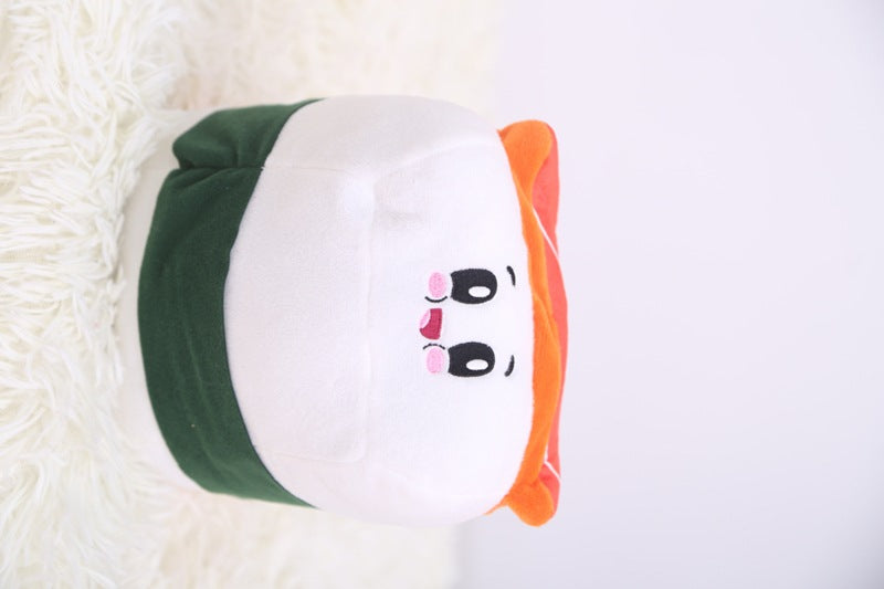 One plush sushi roll with white body, green seaweed band, orange topping and cute embroidered face.