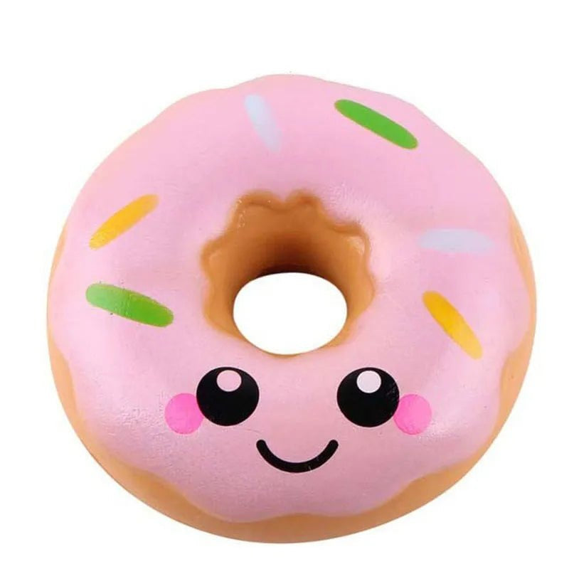 Pink Donut squishy toy with sprinkles and a smiley face, 10 x 10 x 4.5 cm
