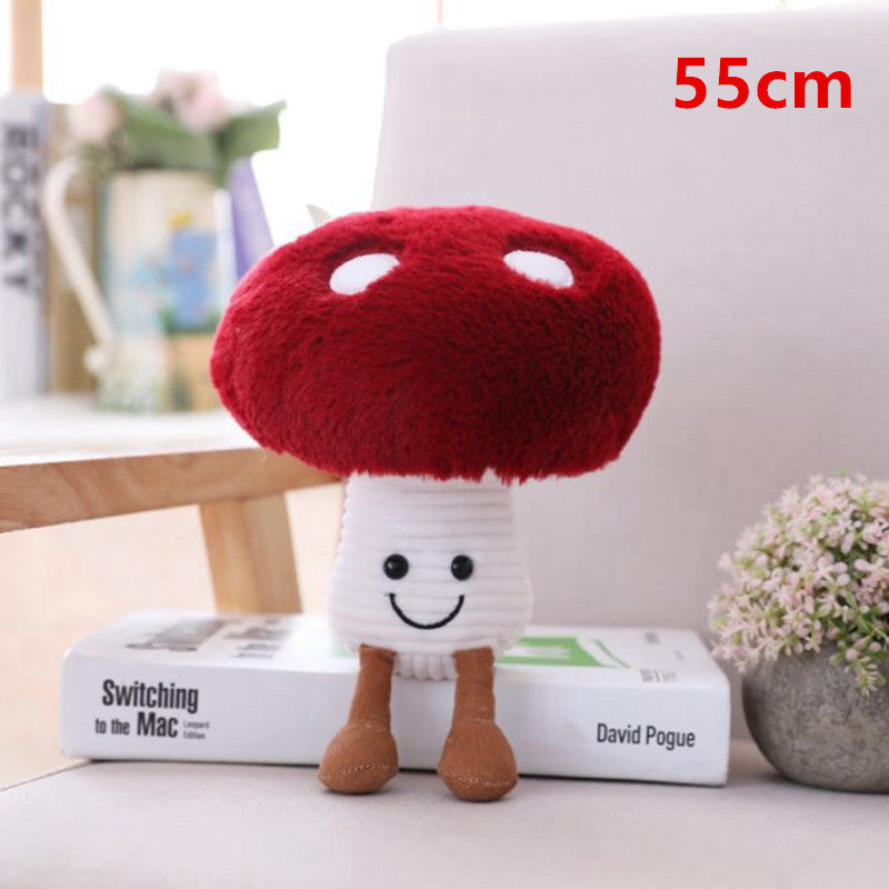One plush mushroom with a fuzzy red cap with white spots, white ribbed stem, smiling face and brown legs.
