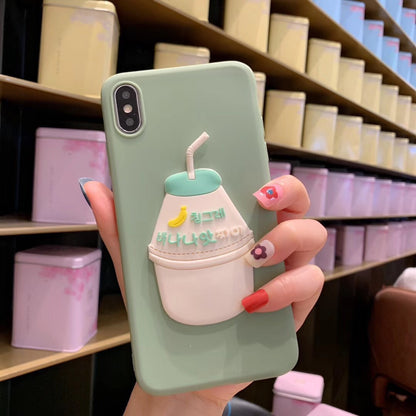 One mint-green iPhone case with a 3D white-and-mint milk cup, straw, yellow banana icon and Korean text.