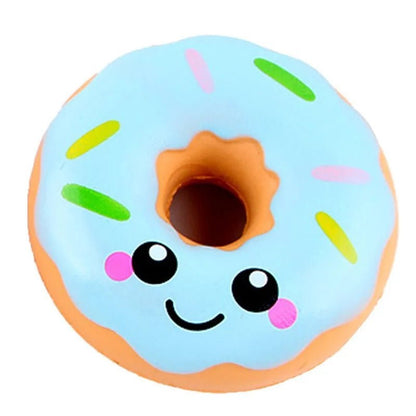 Blue Donut squishy toy with rainbow sprinkles and a smiley face