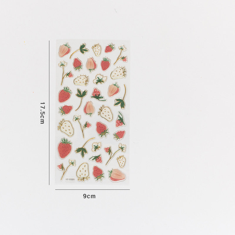 One 17.5×9 cm sticker sheet of red, pale pink and white strawberry and flower stickers with gold outlines.