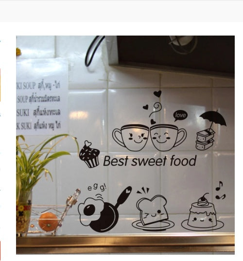Black food magnets on tiles: two smiling cups over "Best sweet food", cupcake, fried egg, toast, cake.