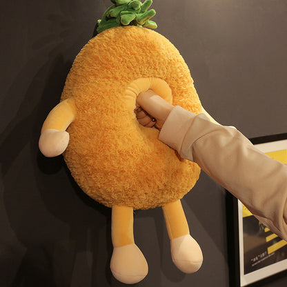 One large yellow fuzzy fruit plush with green leafy top, two arms and legs, and a hand pushed into its cent...