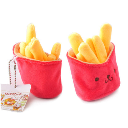 Two red plush french-fry pouches with yellow plush fries; left has ball-chain tag, right has embroidered face.