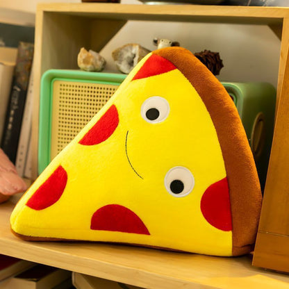 One triangular yellow pizza plush pillow with brown crust, red pepperoni spots, two round eyes and a smile.