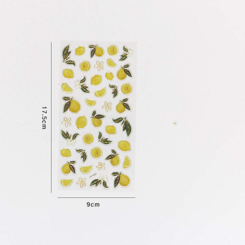 Single 17.5 x 9 cm sticker sheet with gold-edged yellow lemons, lemon slices, green leaves and white flowers.
