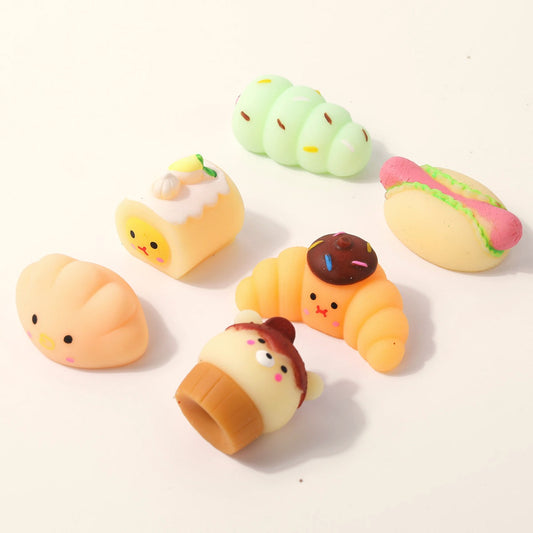 Mini bakery squishies: croissant, hot dog, cake roll and bear cupcake