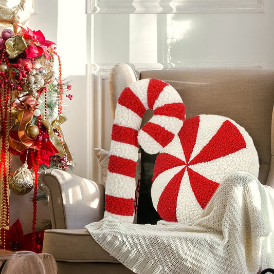Peppermint swirl and candy cane cushions on a cream armchair