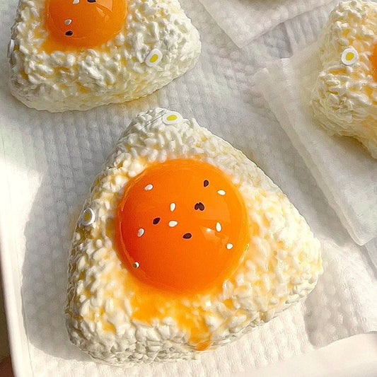 Egg yolk rice ball squishy with sesame seeds