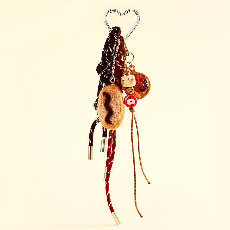 Chocolate baguette bag charm on a braided cord