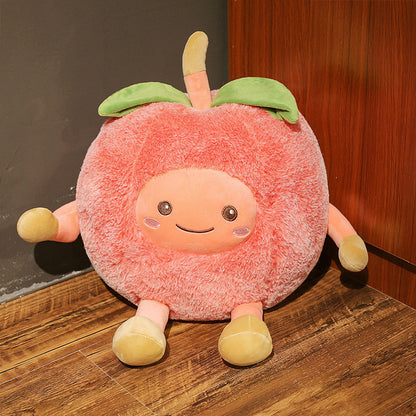 One large round pink plush fruit with a smiling face, four stubby limbs, green leaf and stem.