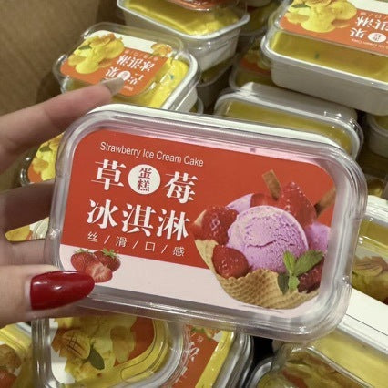 Strawberry ice cream tub squishy held in a hand