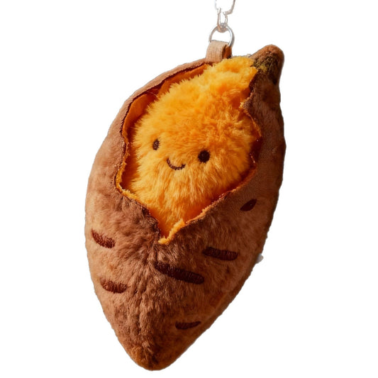 Roasted sweet potato plush charm on a white background