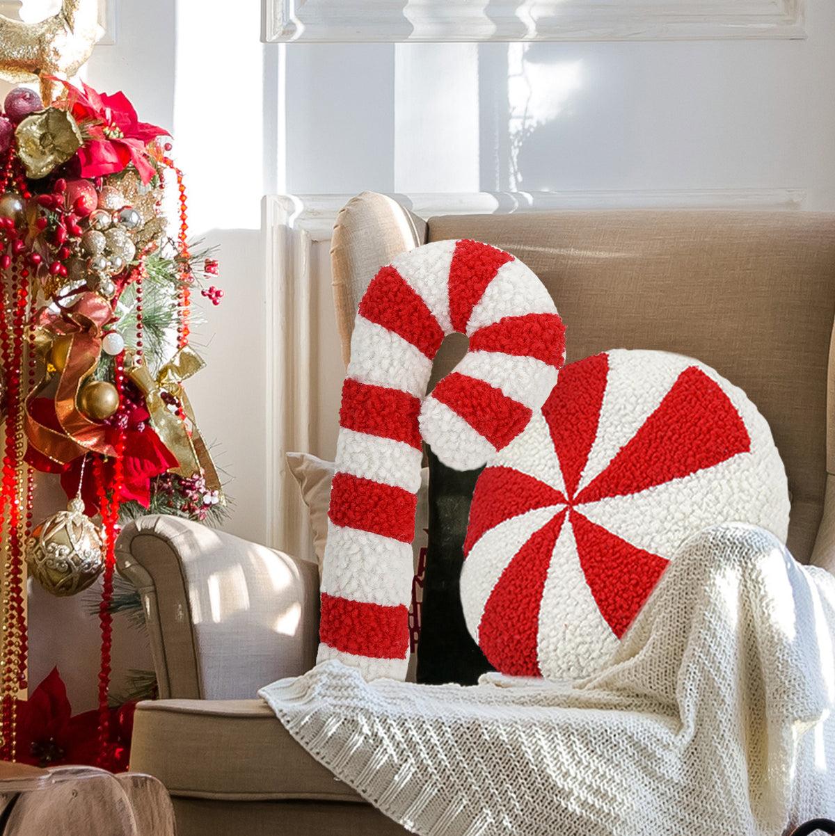 Peppermint swirl and candy cane cushions on a cream armchair